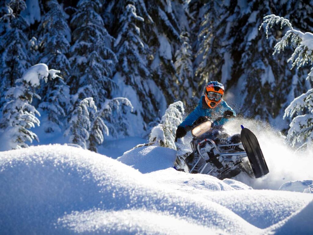 Going snowmobiling is one of the crazy ideas for a bucket list