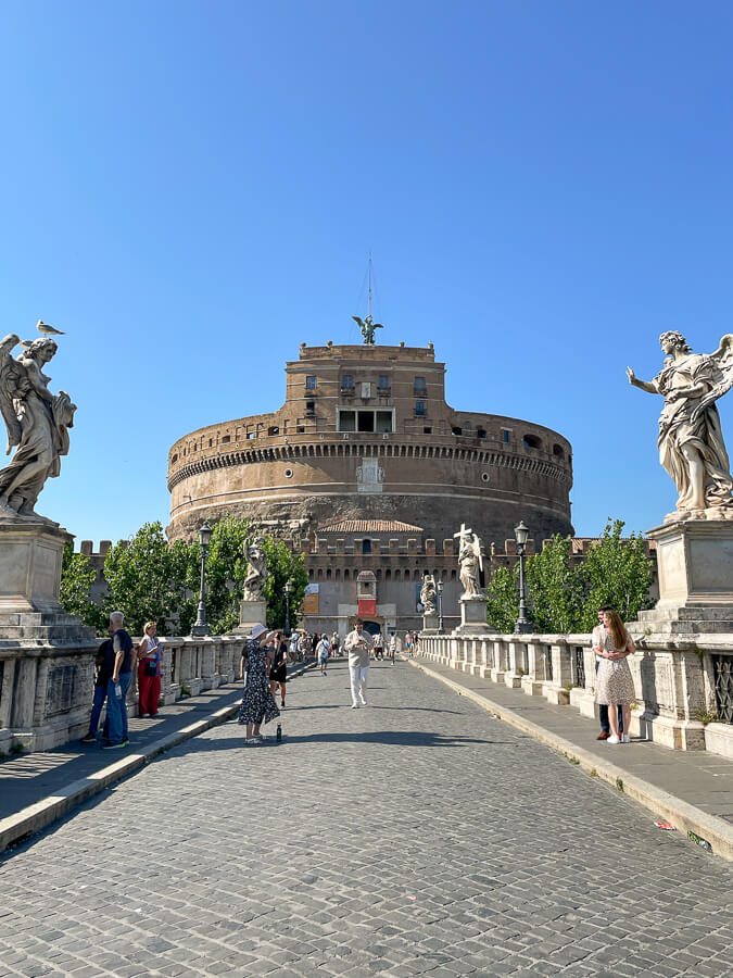 Strolling along Ponte Sant'Angelo is what to do in Rome Italy.